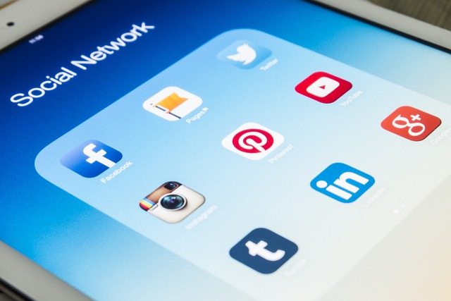 A tablet screen displaying social media app icons including Facebook, Instagram, Twitter, Pinterest, LinkedIn, Tumblr, YouTube, and Google+—perfect for promotions to engage effectively with your audience.