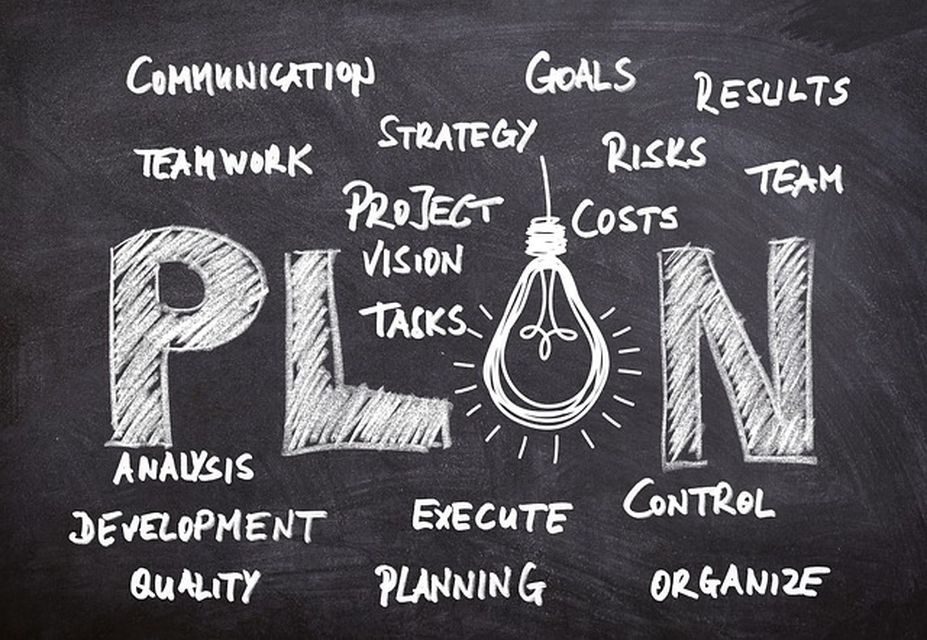 Chalkboard with various words related to planning, such as strategy, goals, costs, risks, teamwork, control, and quality—surrounding the word PLAN and a lightbulb drawing. ESP Features for automated campaigns and subscriber retention are subtly integrated into the creative mix.